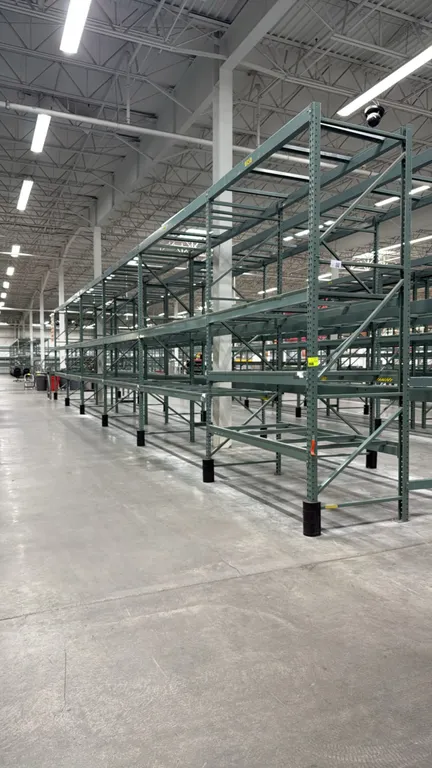 Interlake warehouse pallet racking. Features teardrop upright frames, load beams, and pallet support crossbars. Includes (1) 7'6"L bay and (5) 10'9"L