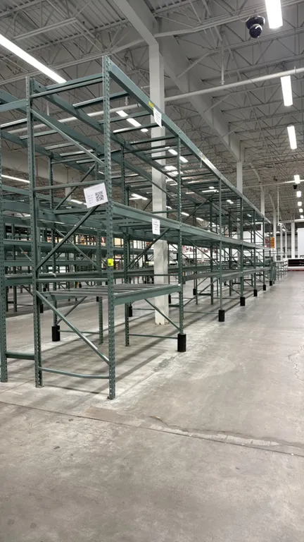 Interlake warehouse racking. Features green uprights, cross beams, and pallet support crossbars with teardrop punch design. Includes (1) 7'6"L section