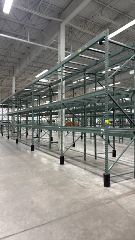 Interlake warehouse pallet racking. Includes (1) 7'6"L section and (5) 10'9"L sections. Features teardrop uprights, load beams, pallet cross supports,