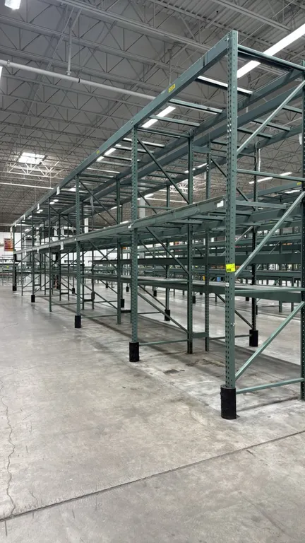 Interlake warehouse pallet racking. Features teardrop uprights, load beams, wire decking, and pallet support bars. Includes (1) 7'6"L and (5) 10'9"L b