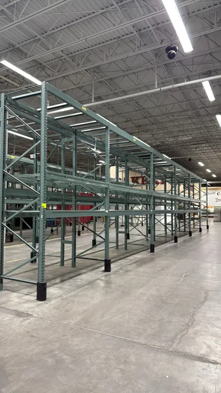 Interlake warehouse pallet racking. Features teardrop uprights, adjustable cross beams, pallet supports, and wire mesh decking. Includes (1) 7'6"L bay