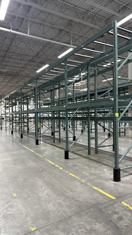 Interlake warehouse pallet racking. Features teardrop punch pattern uprights, step beams, and pallet support crossbars. Includes (1) 7'6"L bay and (5)