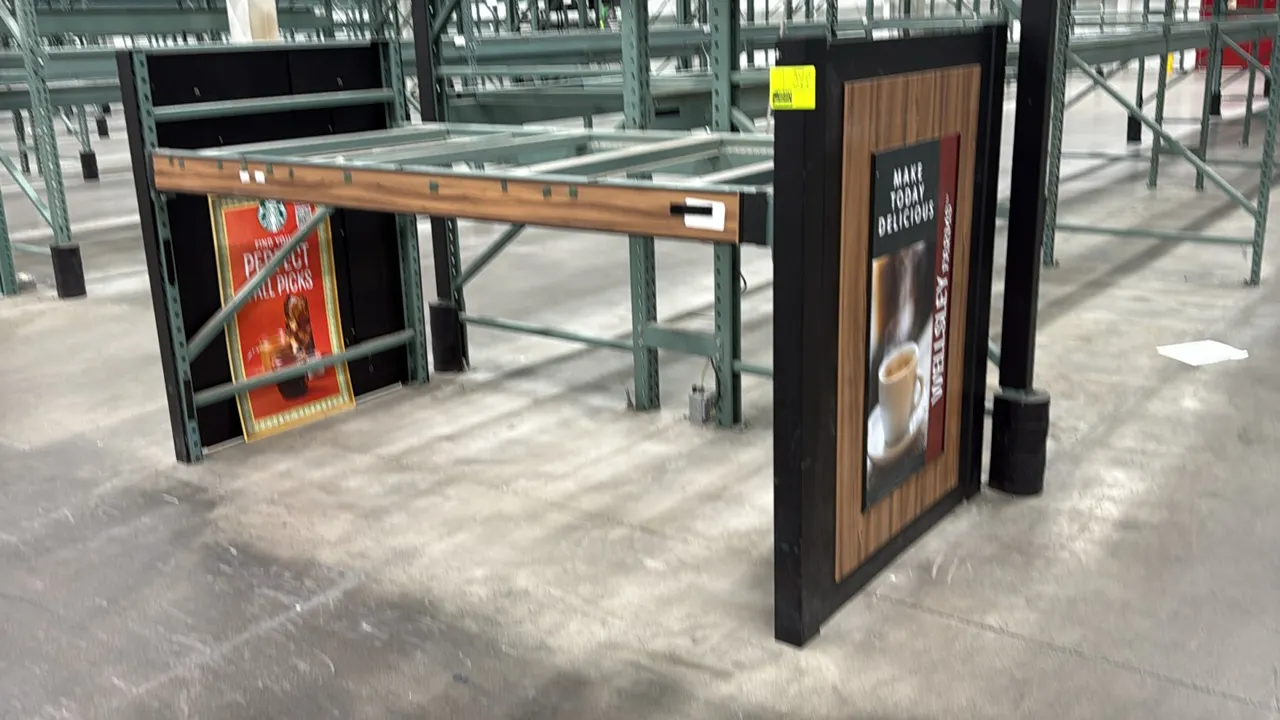 7'6"L Interlake warehouse racking. Dimensions: 7'6"L x 3'8"W x 4'6"H. Features woodgrain beam trim, decorative endcap display panels, and support cros