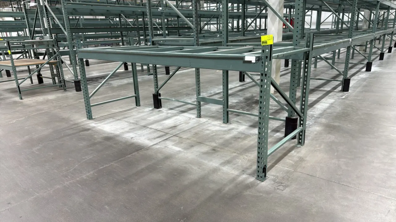 Interlake warehouse pallet racking. Features teardrop punch pattern uprights, load beams, and cross support rails. Finished in green. 10'9" x 3'8" x 4