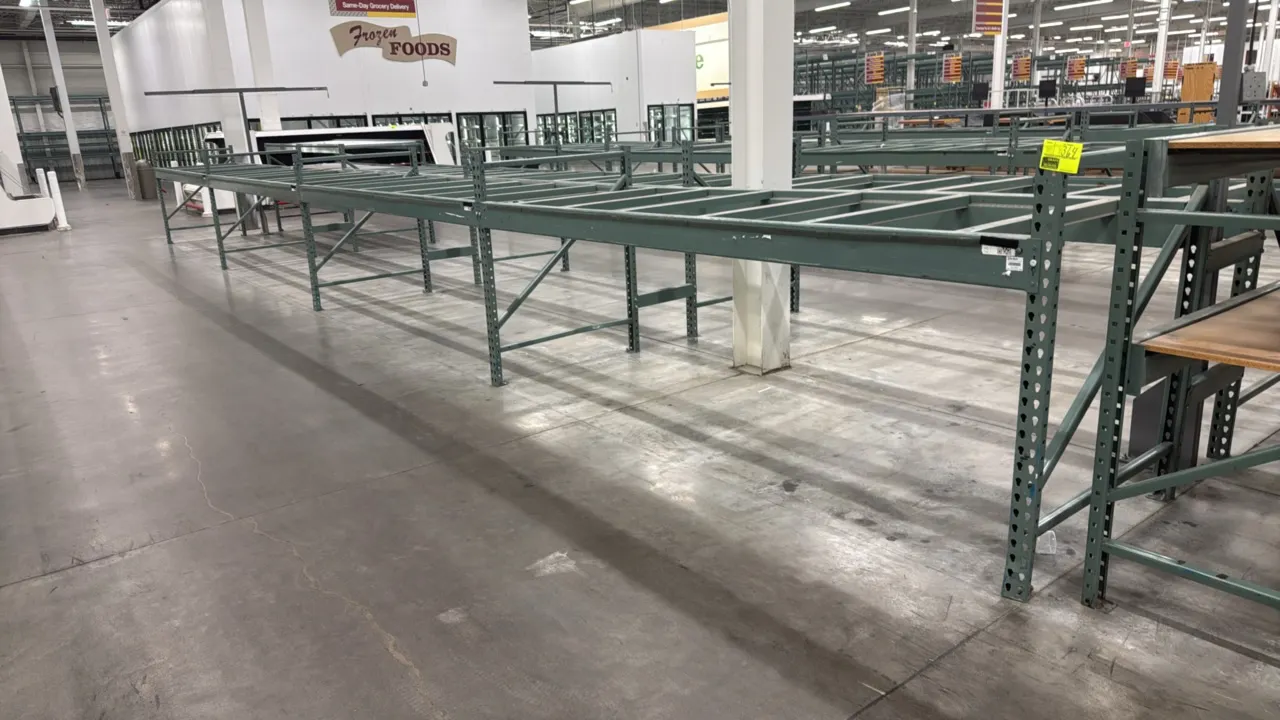 Interlake warehouse racking. Features teardrop style uprights, load beams, and cross support bars. Steel construction with green finish. Dimensions: 1