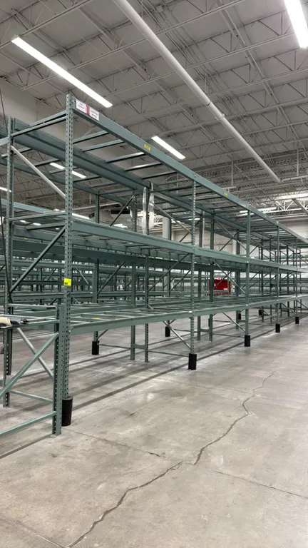 Interlake warehouse pallet racking. Features teardrop-style uprights, adjustable cross beams, and pallet support bars. Dimensions: 10'9" x 3'8" x 12'6