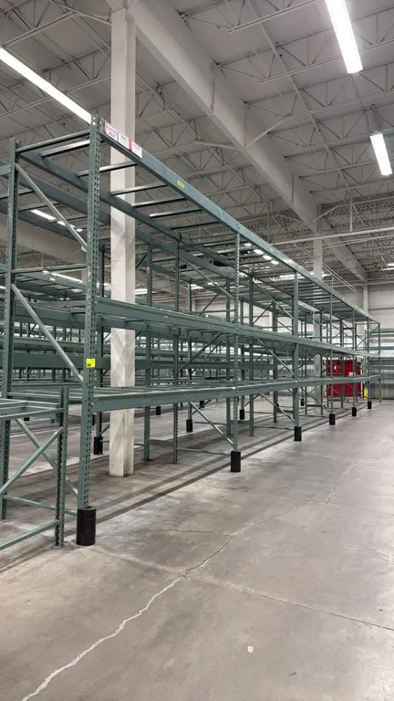 Interlake warehouse pallet racking. Features teardrop uprights, cross beams, pallet support crossbars, and green finish. Dimensions: 10'9" x 3'8" x 12