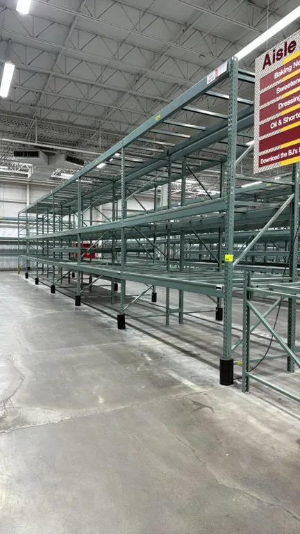 Interlake warehouse pallet racking. Features teardrop uprights, step beams, pallet support crossbars, and green finish. Dimensions: 10'9"L x 3'8"W x 1