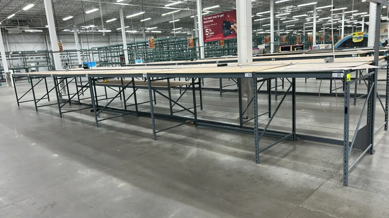 Light-duty metal warehouse racking units. Features steel upright frames, horizontal support beams, and corkboard deck tops. Dimensions: (5) 50" x 90"