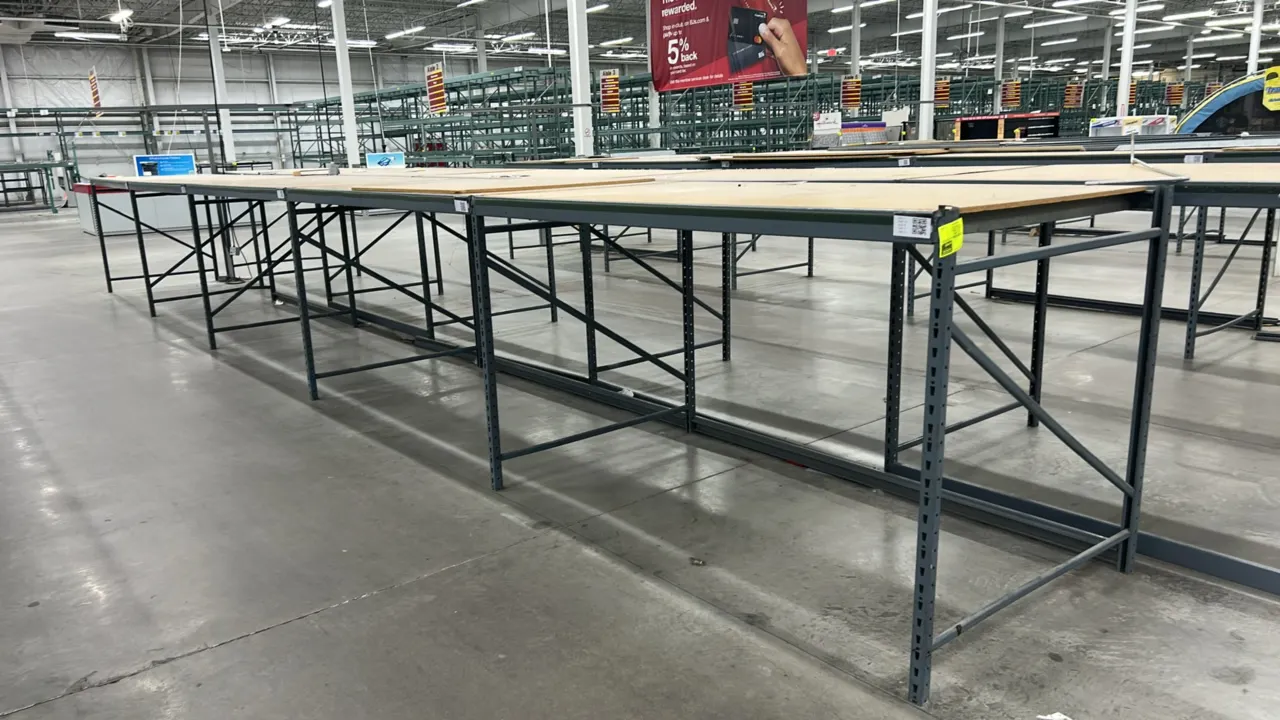 Metal light-duty warehouse racking with corkboard decks. Features steel upright frames, cross beams, and deck supports. Dimensions: 50" x 90" x 54".