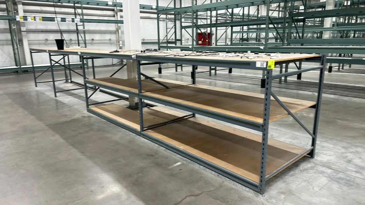 Metal light-duty warehouse racking. Features gray steel upright frames, horizontal support beams, and corkboard decking. Dimensions: 50" x 90" x 54" e