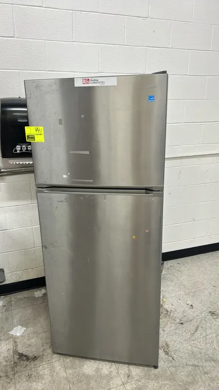 Danby DFF143V1SSDB top-freezer refrigerator. Features a stainless steel finish, top freezer compartment, glass shelving, dual crisper drawers, door bi