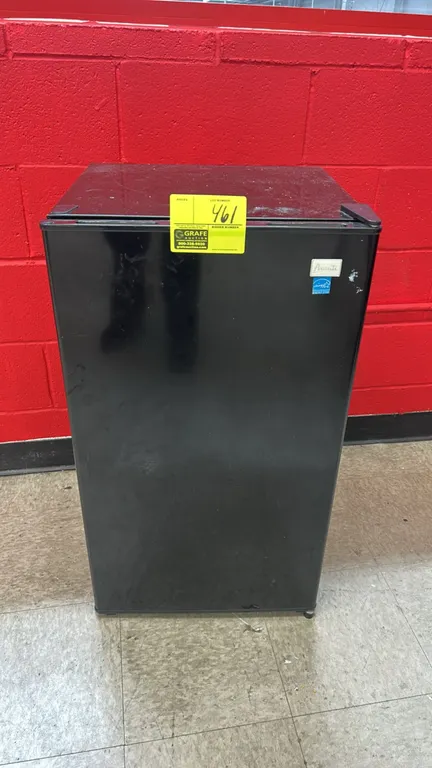 Avanti compact mini refrigerator. Features a black finish, single door, upper chiller compartment, interior shelving, and in-door storage bins. Conten