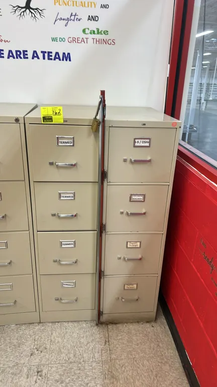 HON metal 4-drawer vertical filing cabinets. Features metal construction, pull handles, label card holders, and a neutral putty finish. Includes verti