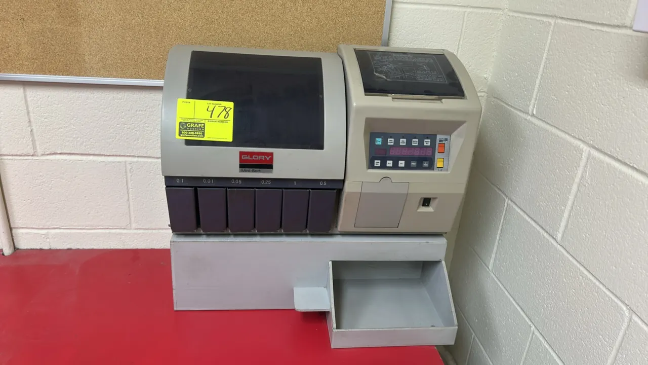 Glory Mini-Sort 9A4145 coin sorter and counter. Features digital display, push-button controls, six sorting channels, and a metal countertop riser sta