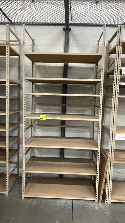 Metal multi-tier light-duty warehouse racking units. Features adjustable shelf levels with wood decking and tan steel uprights. Dimensions: 24" x 48"