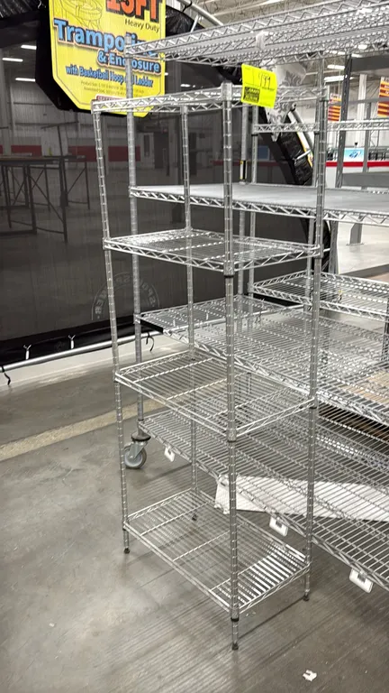 Metro-style 5-tier wire shelving rack. Features adjustable wire shelves and chrome finish. 13" x 13.5" x 60". Mounted on leveling feet.