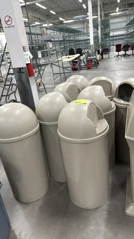 Polyethylene torpedo trash cans. Features tan molded plastic construction, cylindrical bodies, and dome-top lids with swing-door waste disposal openin