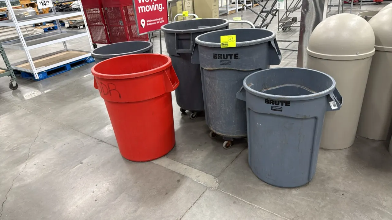 Rubbermaid BRUTE and assorted poly trash cans. Features molded side handles and heavy-duty plastic construction in gray and red finishes. Select units