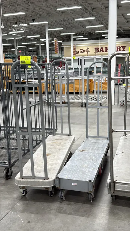 U-boat stocking carts. Features molded plastic and diamond-plate steel platform decks with tall tubular steel handles. 5'L. Mounted on casters. Note: