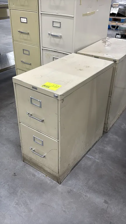Stylex 2-drawer metal vertical file cabinets. Features tan finish, pull handles, and integrated label holders.