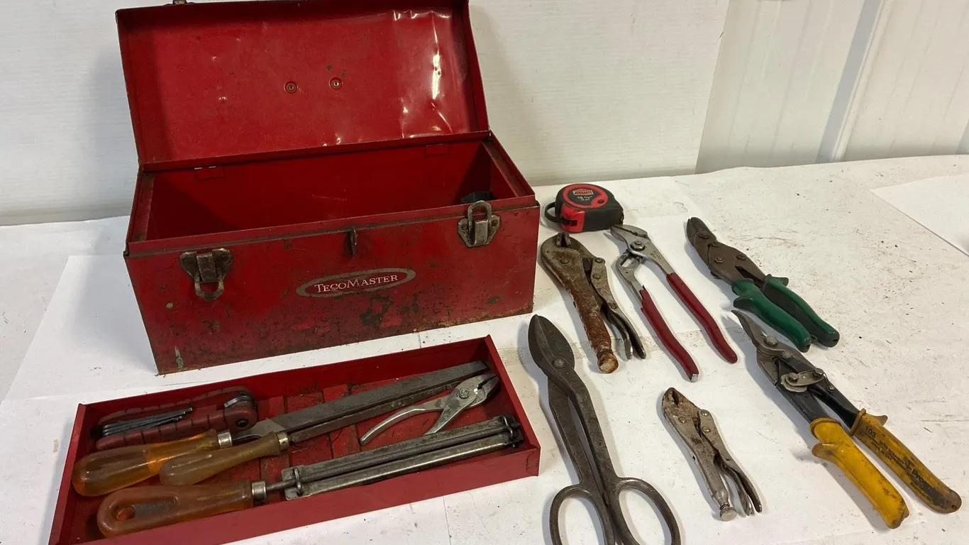 Small steel tool box with tools.