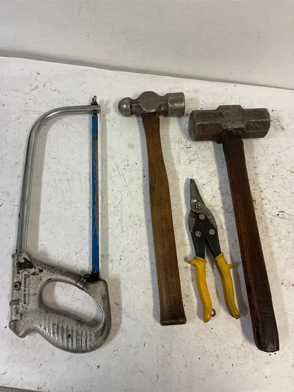 Hacksaw. 3 and 6 lb Hammers. Tin snips.