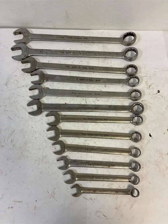 Gray SAE combination wrenches.