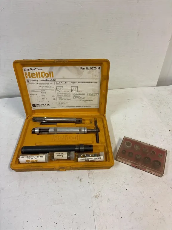 HeliCoil spark plug thread repair kit.