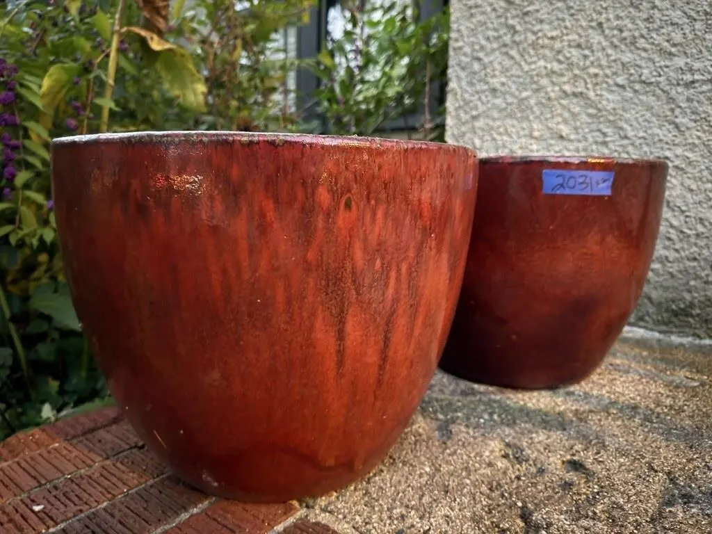 Matching red flower pots (2)