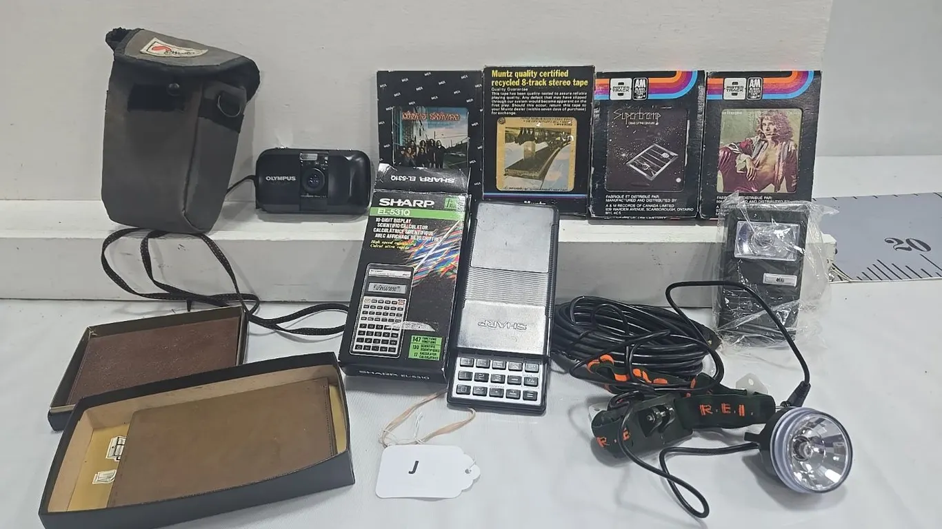 Olympus Camera, 8- Tracks, Calculator, Wallets, Head Lamp