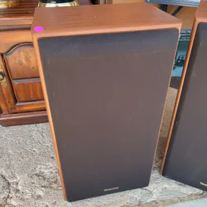 vintage Technics SB-CR77 floor speaker with a wood-grain cabinet and a black fabric grille featuring