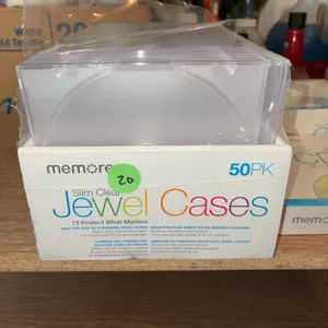 Memorex slim clear CD/DVD jewel cases and blank recordable Memorex CD-Rs.