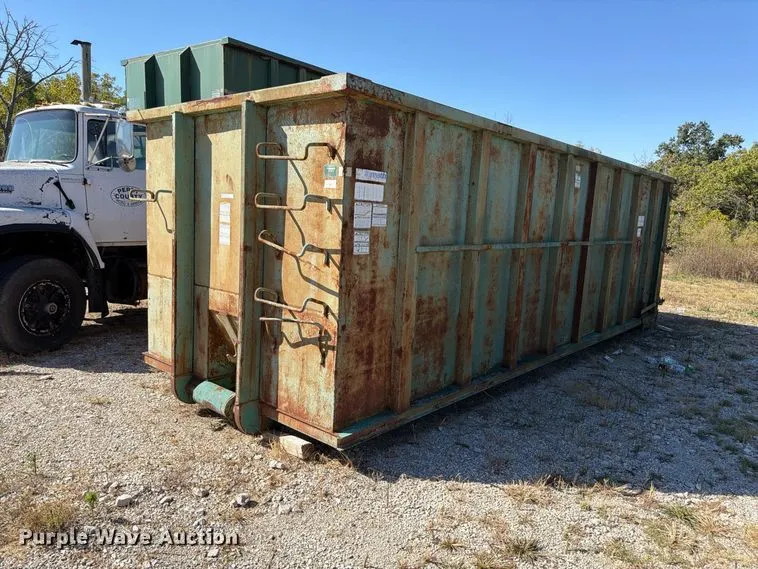 (2) enclosed roll off containers