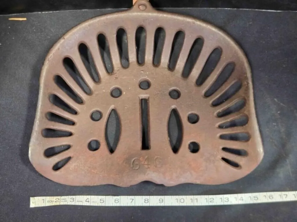 Vintage cast iron implement seat, intact