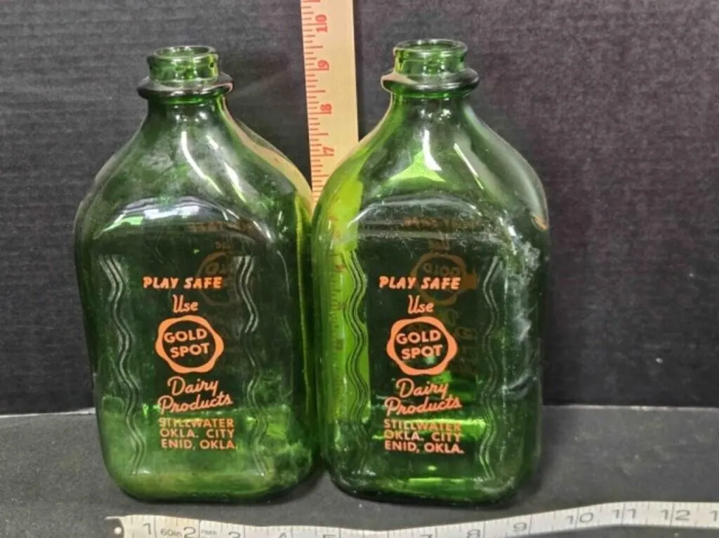2 Gold Spot milk bottles