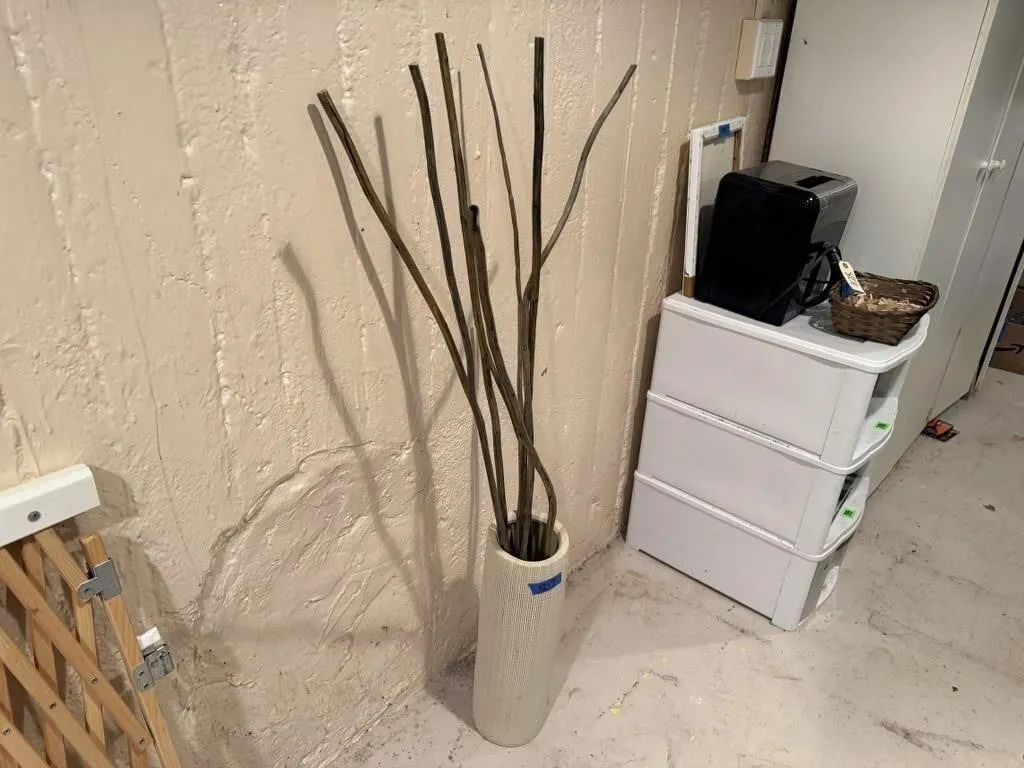 Pottery floor vase, decorative sticks