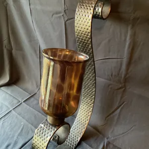 Wall Sconce with Hammered Metal Bracket and Amber Glass Hurricane Shade