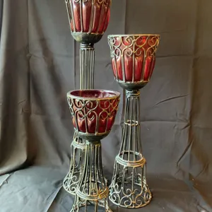 Three Ornate Metal and Red Glass Candle Holders