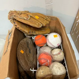 Large Group Of Baseballs, Softballs and Gloves