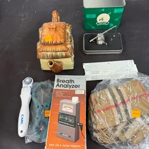 Grouping Of Assorted Items Including Burberry And Fisherman Desk Clock