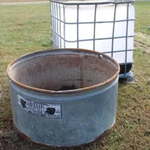 44' Round Water Tank & Plastic Tank in Cage