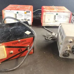 2 Motomaster 6 Amp Battery Chargers, Torcan Charger, and Dial Control Unit