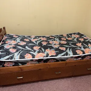 Single Wooden Bed Frame With Three Drawers And Floral Mattress