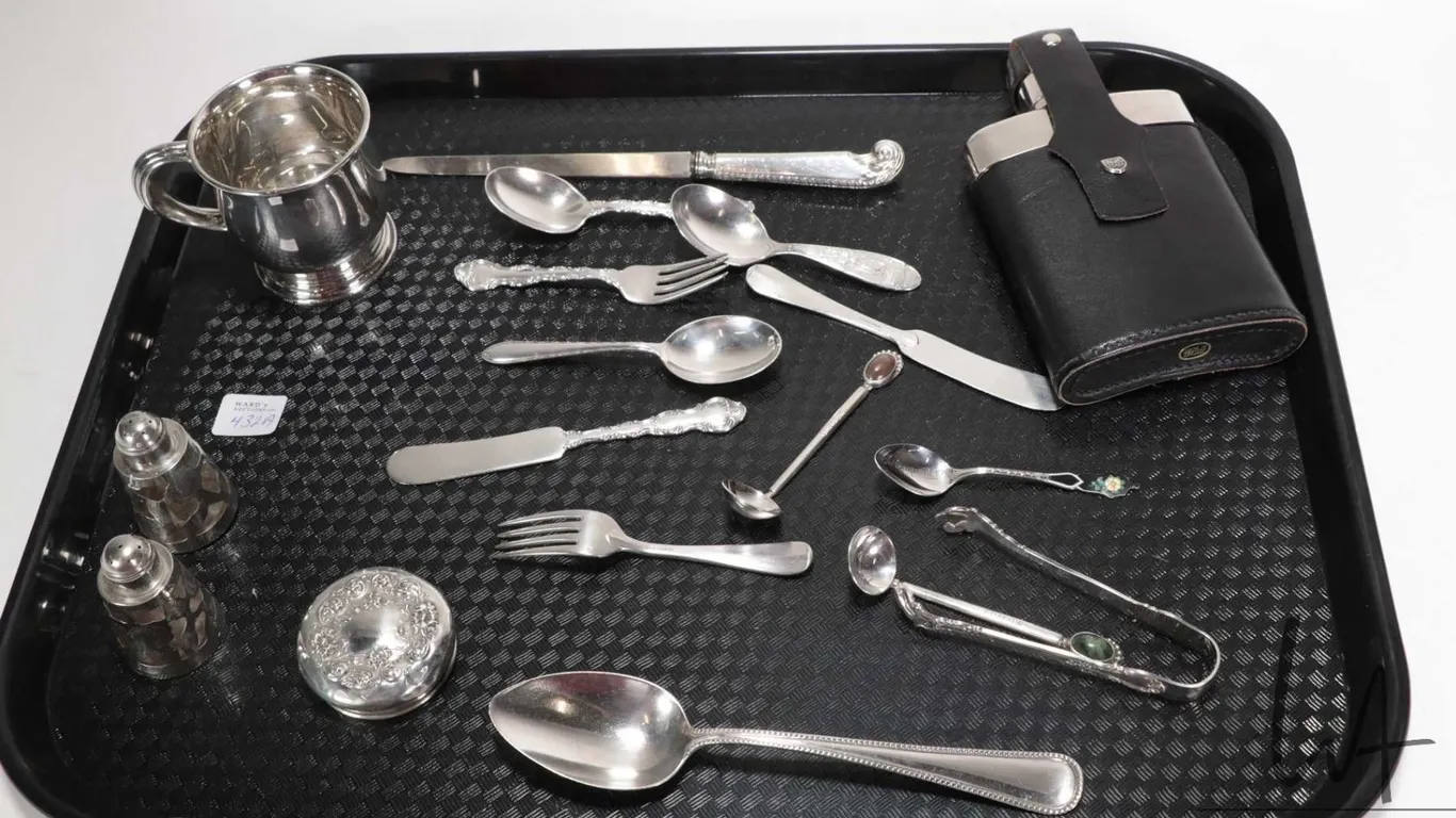 Selection of sterling silver including Birks sterling baby mug and sugar tongs, plus various spoons,