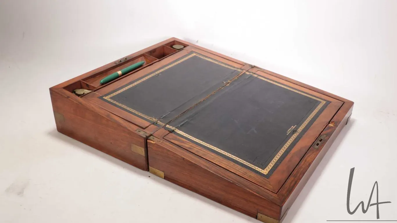 Antique leather topped, rosewood folding writing slope marked A. Sutherland Edinburgh, includes orig