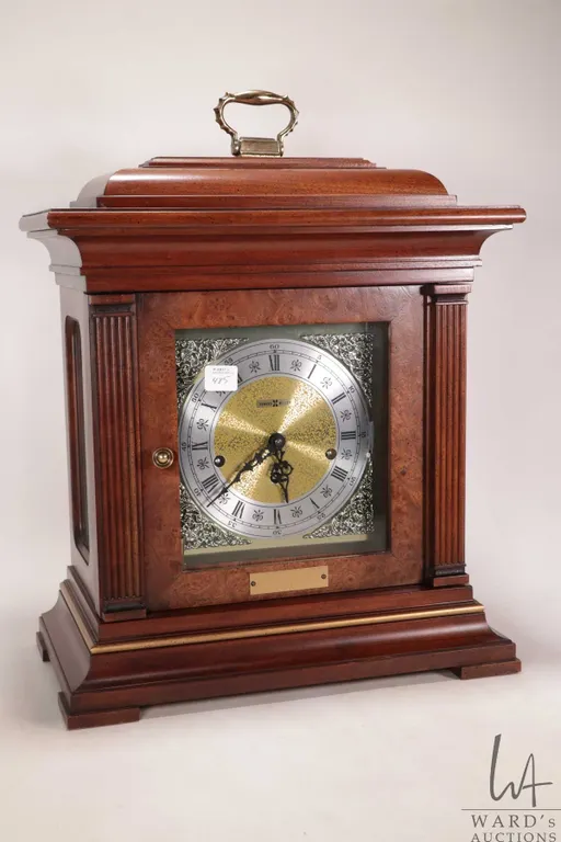 Wood cased chiming mantle clock by Howard Miller, not working at time of cataloguing, won't stay run