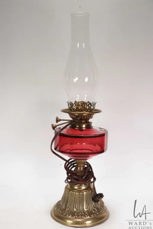 Antique oil map with cranberry glass font and brass base with electric Young's Special adaptation an
