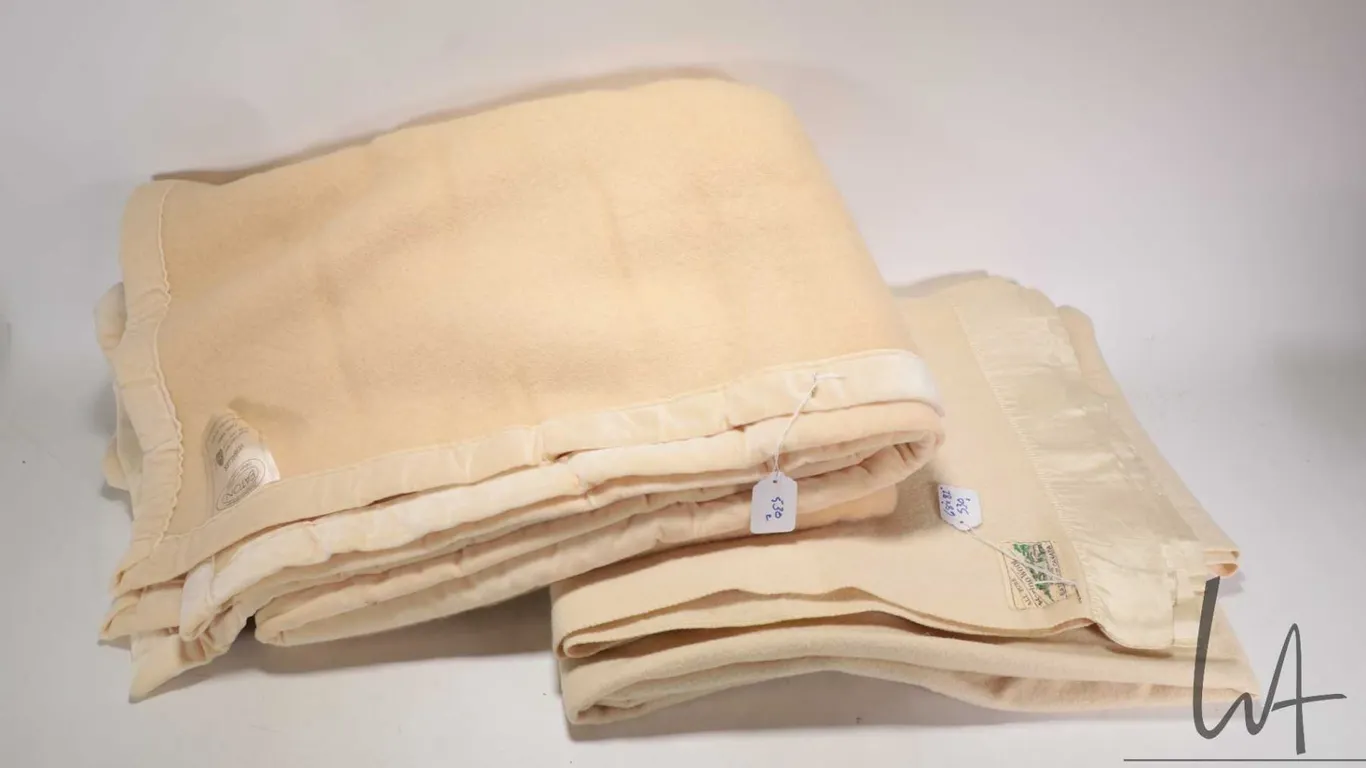 Two vintage wool blankets, both made for Eatons including English made Merino wool 68" X 82 and a Ve