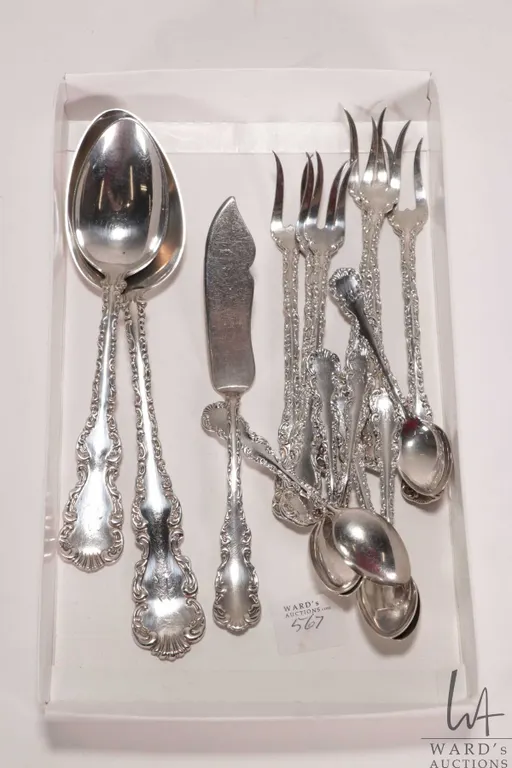 Selection of sterling silver flatware including Louis XV patterned serving spoon, tablespoon, spread